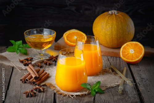 Pumpkin and orange spiced fall cocktail with cinnamon