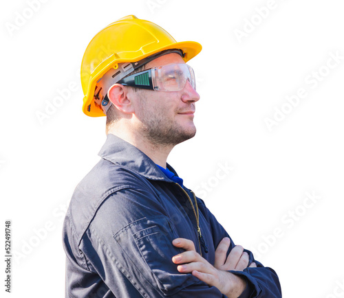 Smiling factory worker man in hard hat with crossed arms on white background photo