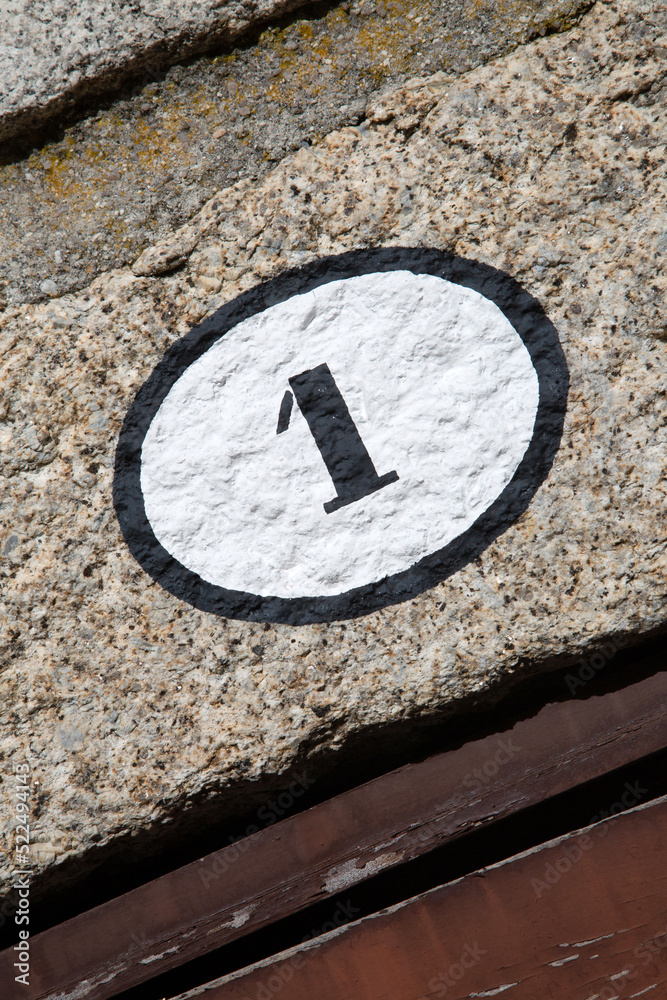 Number One on Stone Wall on Diagonal Tilt Number One on Stone Wall on Diagonal Tilt