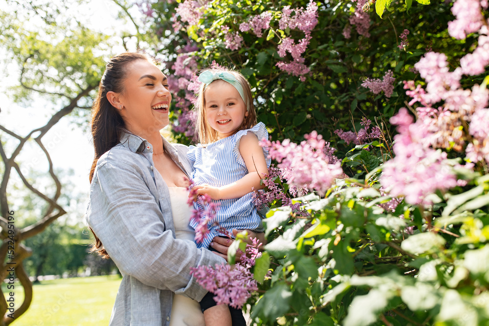 family, motherhood and people concept - happy mother with little daughter at summer park or garden family, motherhood and people concept - happy mother with little daughter at summer park or garden