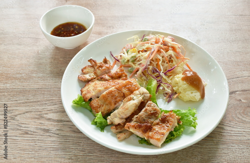 grilled chicken black pepper steak dipping spicy sauce with mashed potato dressing gravy and salad on plate 