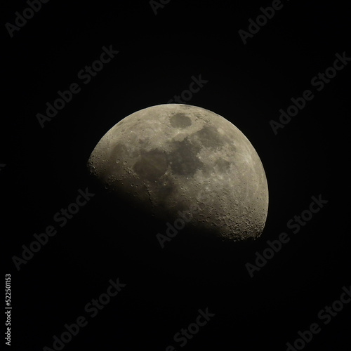 Half moon on black sky background at night