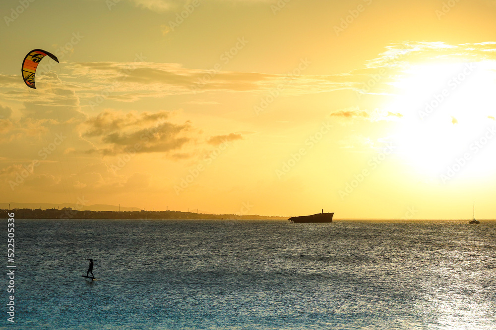 Sunset on the sea of Fortaleza with silhouette of a shipwreck