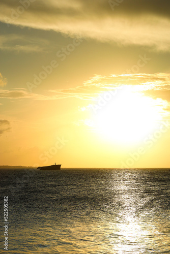 Sunset on the sea of Fortaleza with silhouette of a shipwreck © Eduardo
