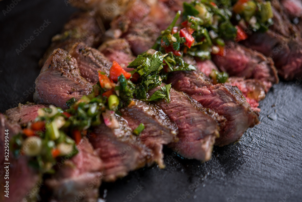 Delicious beef steak served with french fries with parmesan and rosemary Delicious beef steak served with french fries with parmesan and rosemary