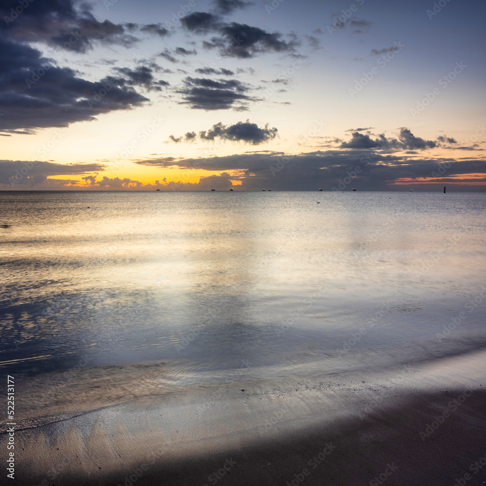 Beautiful sunrise on the beach of Baltic Sea in Sopot, Poland - obrazy, fototapety, plakaty 
