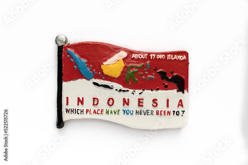 Colorful souvenir fridge magnet from Indonesia isolated on white background.