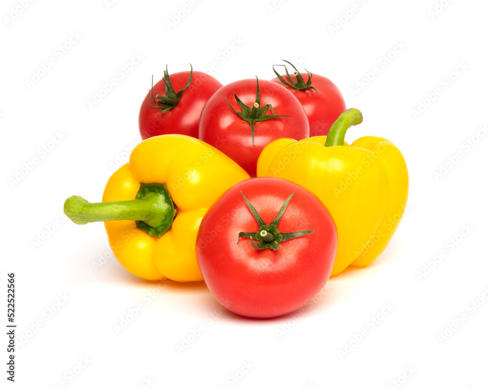 Fresh vegetables, whole red tomato and yellow bell pepper (paprika) isolated on white background Fresh vegetables, whole red tomato and yellow bell pepper (paprika) isolated on white background