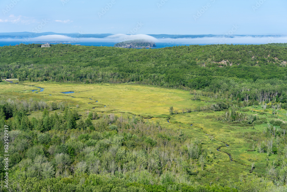 Meadow, islands covered by clouds in Acadia National Park