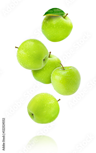 Fresh green apple fruit with water droplets flying in the air isolated on white background.