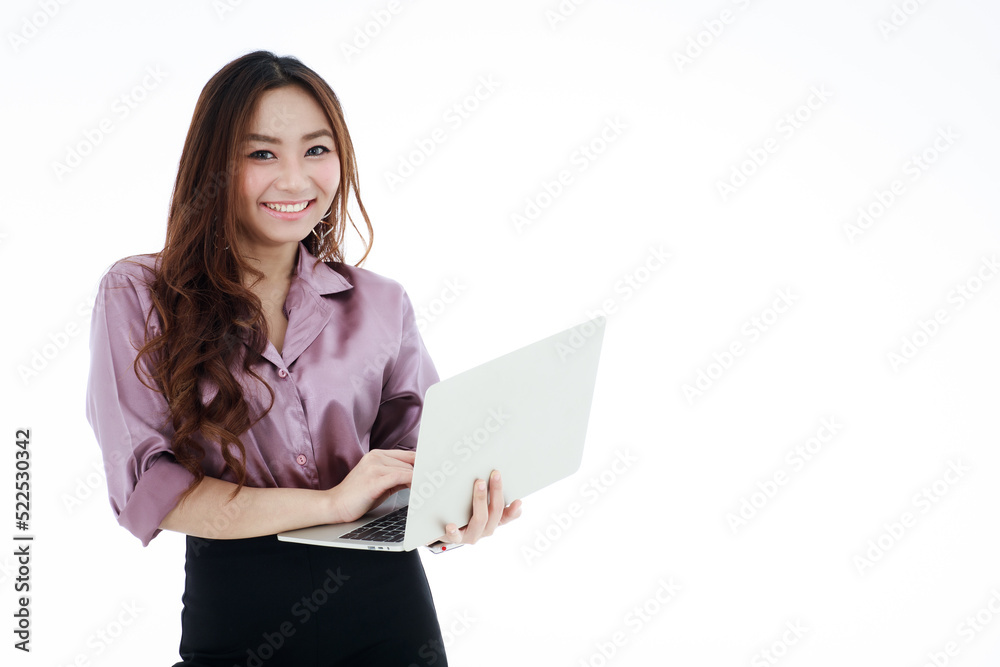 .A beautiful young woman in casual work clothes holds a laptop computer and smiles in a friendly, happy and enthusiastic way.. .A beautiful young woman in casual work clothes holds a laptop computer and smiles in a friendly, happy and enthusiastic way..