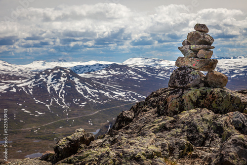 Inukshuk, Stacked stones above jotunheimen mountains in Norway © Aide