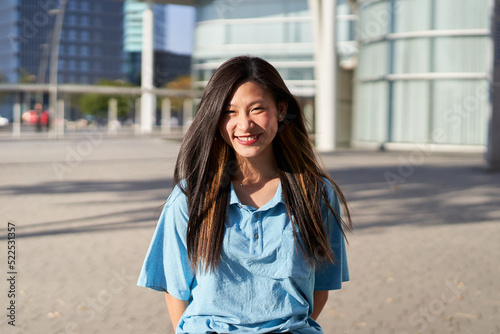 Happy asian female Student. Girl smiling at camera outdoors on campus of university © CarlosBarquero