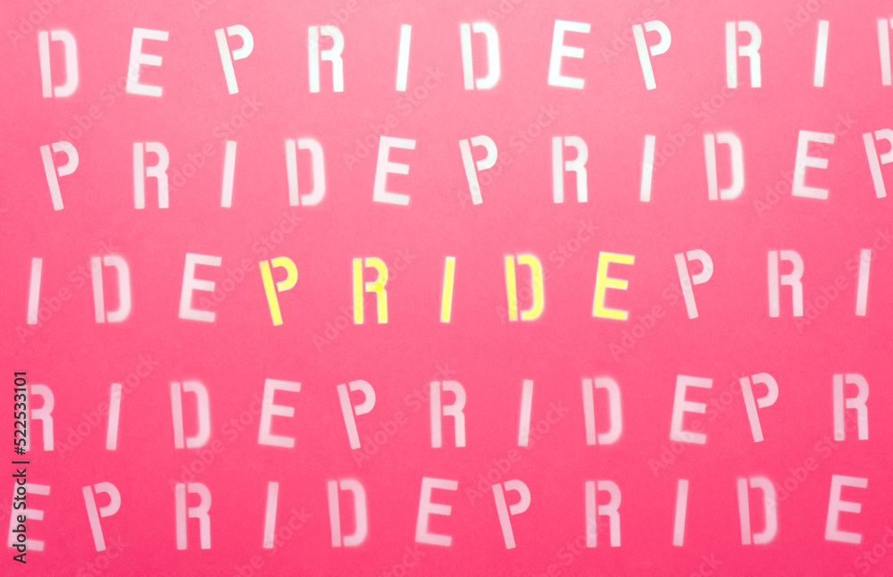 sign with white letters on a pink background with the message PRIDE
sign with white letters on a pink background with the message PRIDE