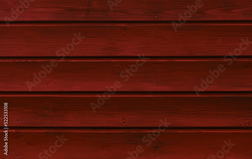Stylish bright background for web design or lettering. Concept minimalistic horizontal red wooden background. Norwegian frame house, wall close-up. Freshly painted bright red wooden wall.
