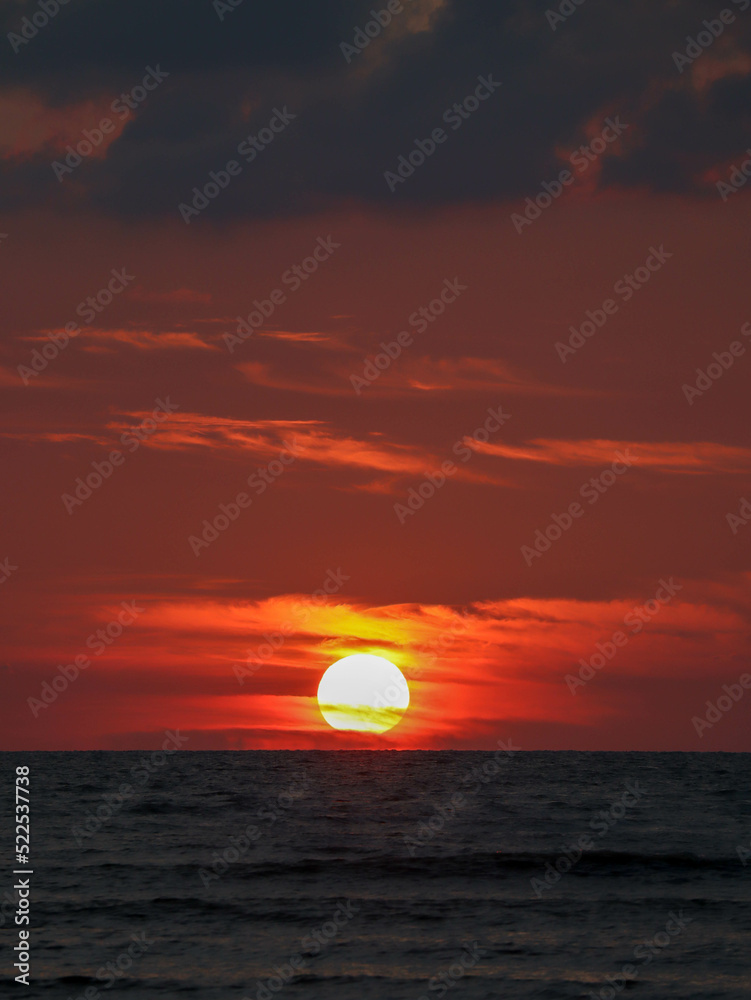 magical sunset with clouds over the ocean magical sunset with clouds over the ocean