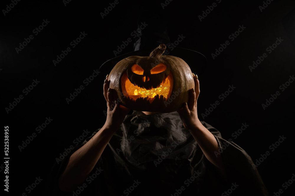Pumpkin jack o lantern instead of a woman's head. Halloween - obrazy, fototapety, plakaty 