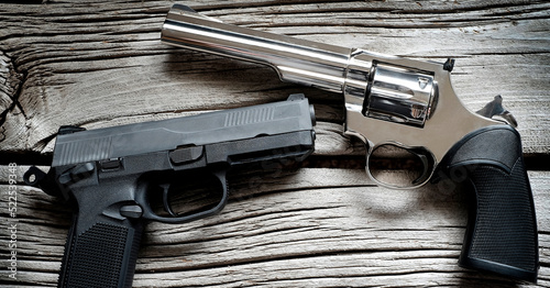 фотографія Handguns Pistols on Old Wood Weapons for Self Defense