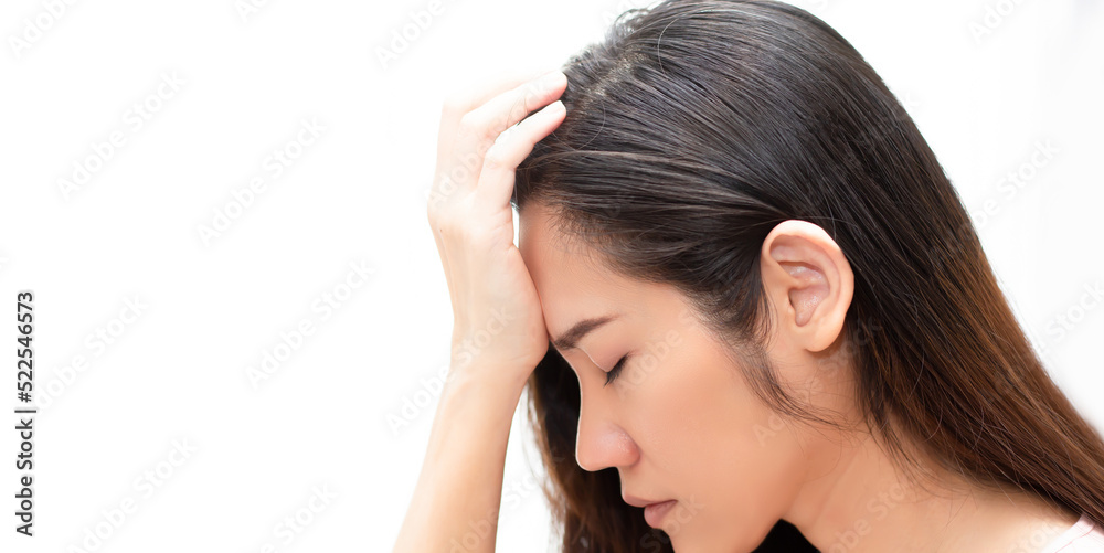 Fototapeta premium Close up Asian beautiful woman touch head by hand with feeling worried. Metal concept and Broken heart.