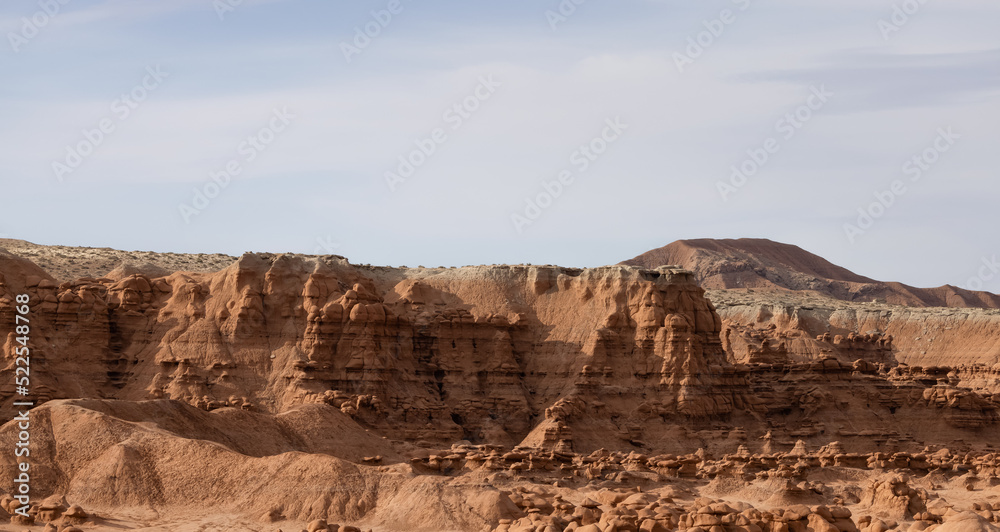 Red Rock Formations and Hoodoos in the Desert at Sunrise. Spring Season. Goblin Valley State Park. Utah, United States. Nature Background.