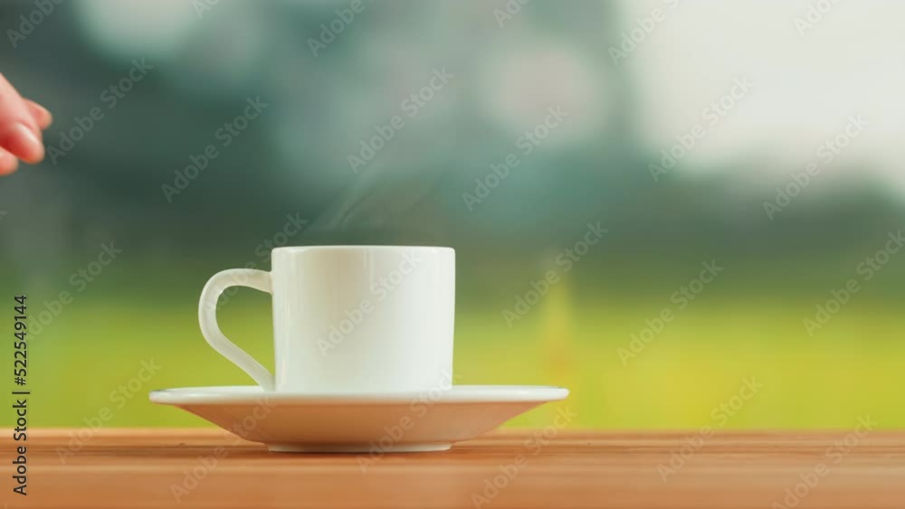 Hot coffee in white cup on a wooden table. Tea ceremony process, healthy morning, freshly brewed detox drink. Hot coffee in white cup on a wooden table. Tea ceremony process, healthy morning, freshly brewed detox drink.