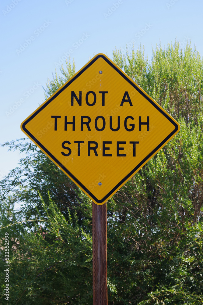 NOT A THROUGH STREET traffic warning sign NOT A THROUGH STREET traffic warning sign