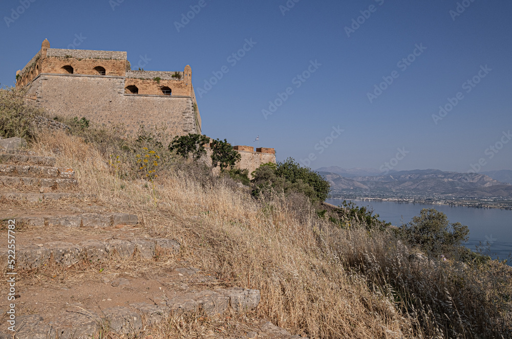 The Castle of Palamidi, the best well-maintained huge castle, the Venetian fortifications architectural masterpice, located in Nafplio on the crest of a 216m cliff, Argolis, Peloponnese, Greece The Castle of Palamidi, the best well-maintained huge castle, the Venetian fortifications architectural masterpice, located in Nafplio on the crest of a 216m cliff, Argolis, Peloponnese, Greece