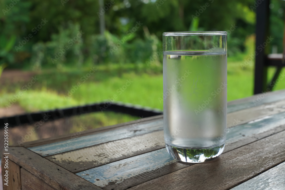 Glass of water outdoors, glass of water and ice on soft background, Glass of water outdoors, glass of water and ice on soft background,