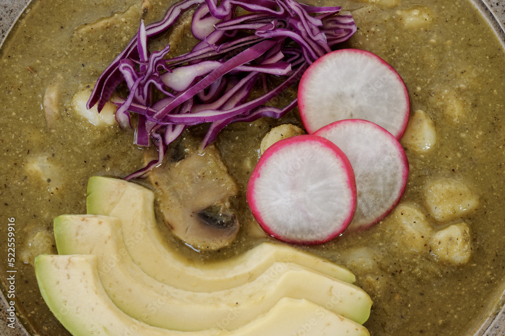 Foto de Green Pozole Verde dish with hominy, tomatillo, shredded