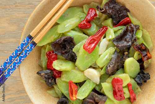 Stir fried celtuce (stem lettuce) with wood ear mushrooms (mun) dish. Chinese cuisine photo