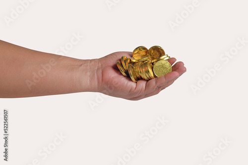 Golden coins money in hand on background.