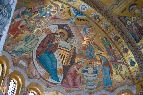 Interior photographs allowed because artwork is formed from tiny colored pieces of glass. No paintings. This artwork is above looking at the ceiling at St Sava Orthodox Christian Church or Temple.