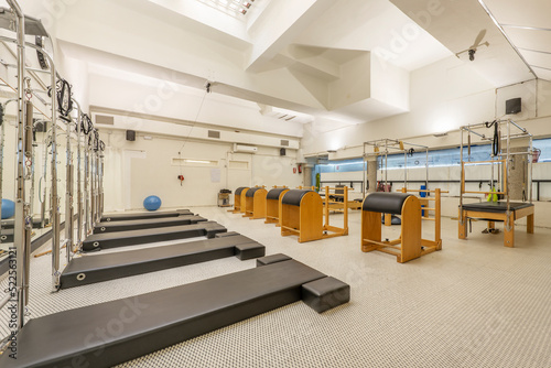 Gym room with various wooden and stainless steel equipment