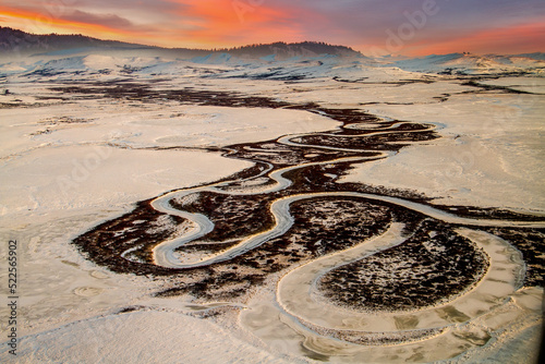 An aerial view of a  winding river on a cold winter morning near Nome, Alaska. photo