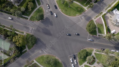Aerial Upward Time Lapse Shot Of Cars Moving On Roads Amidst Trees In City -  Beverly Hills, California