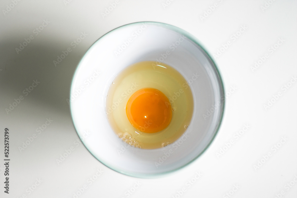 white and egg filled on a ceramic bowl white and egg filled on a ceramic bowl