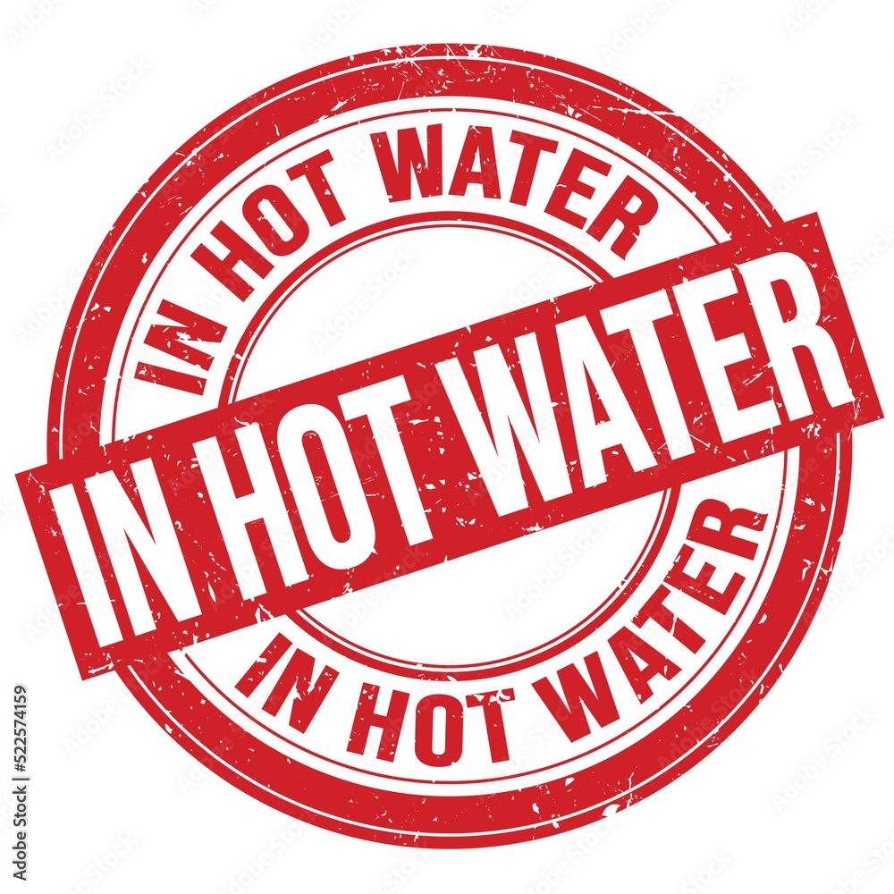 IN HOT WATER text written on red round stamp sign IN HOT WATER text written on red round stamp sign