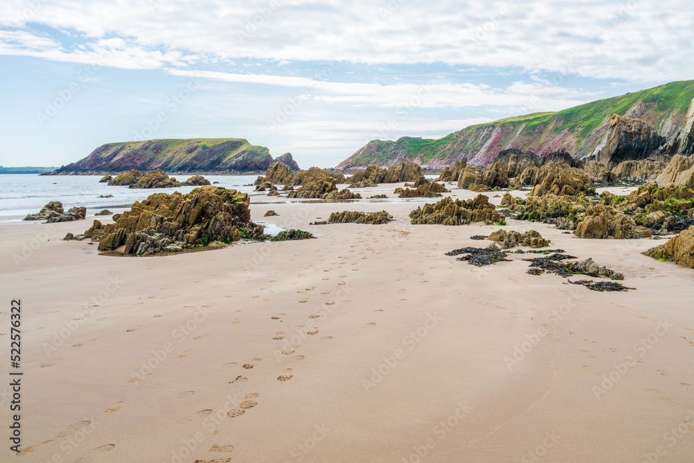 Marloes Sands Beach with rock formations at low tide, Wales Marloes Sands Beach with rock formations at low tide, Wales
