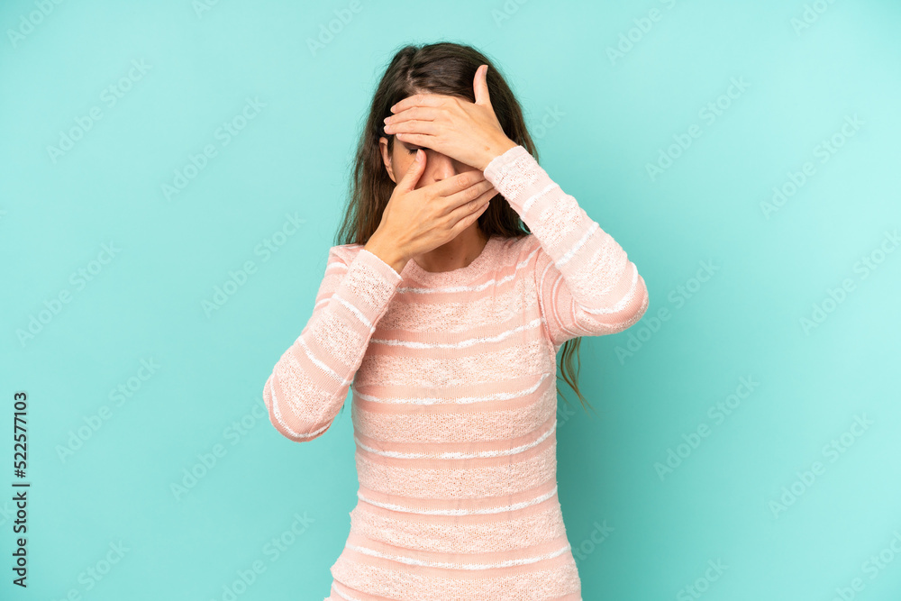 young adult pretty woman covering face with both hands saying no to the ...