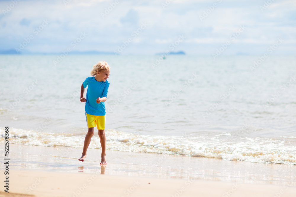 Kids playing on beach. Children play at sea. Kids playing on beach. Children play at sea.