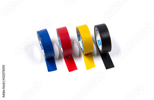 Four insulating adhesive tapes, of different colors, on a white background.