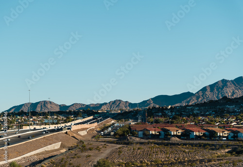 Las Vegas suburb on a sunny day with mountains in the background © MeganKobe