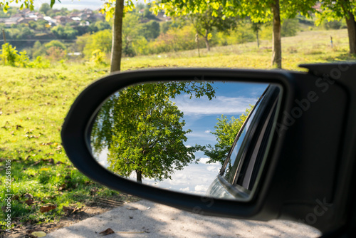 Looking in the side rear-view mirror in the day of dreams