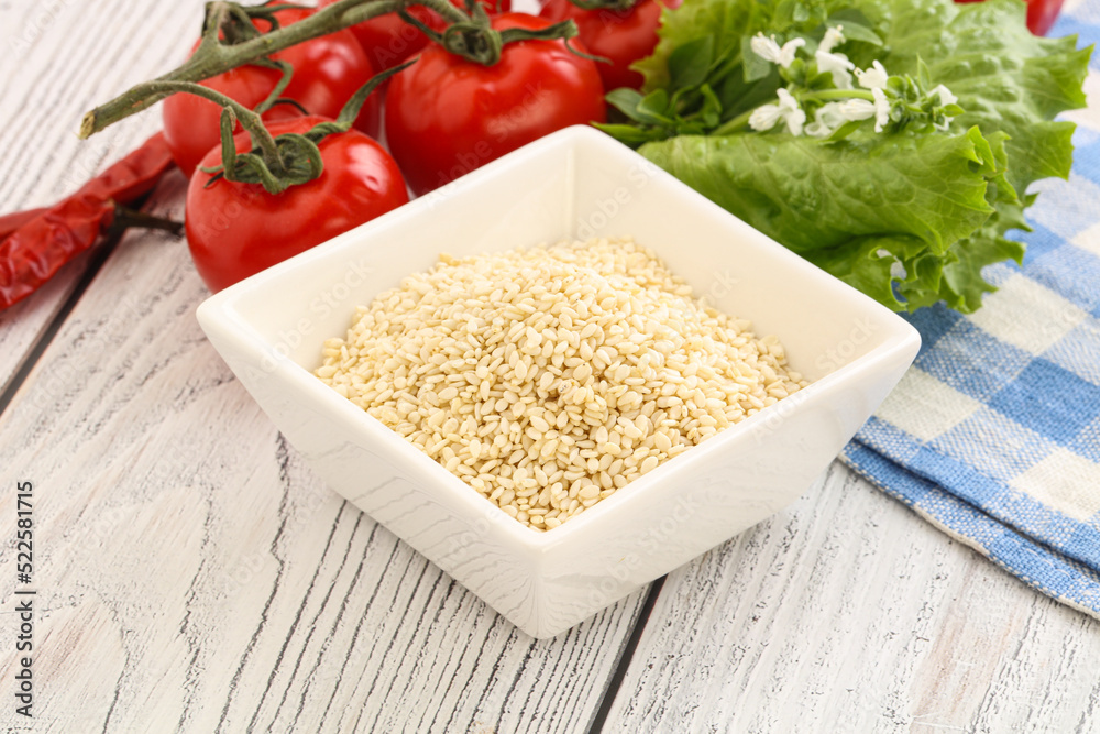 Raw sesame seeds in the bowl Raw sesame seeds in the bowl