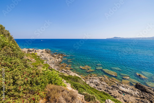 Beautiful view of rocky coast on turquoise water background in Mediterranean sea. Greece.