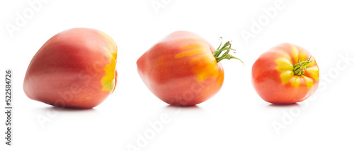 Bull heart tomatoes isolated on white background.