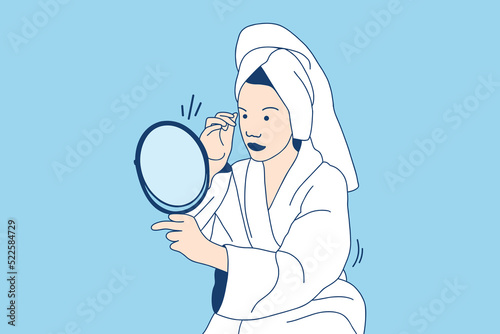 Illustrations Beautiful young woman in bathrobe look at mirror applying cream on face as daily routine