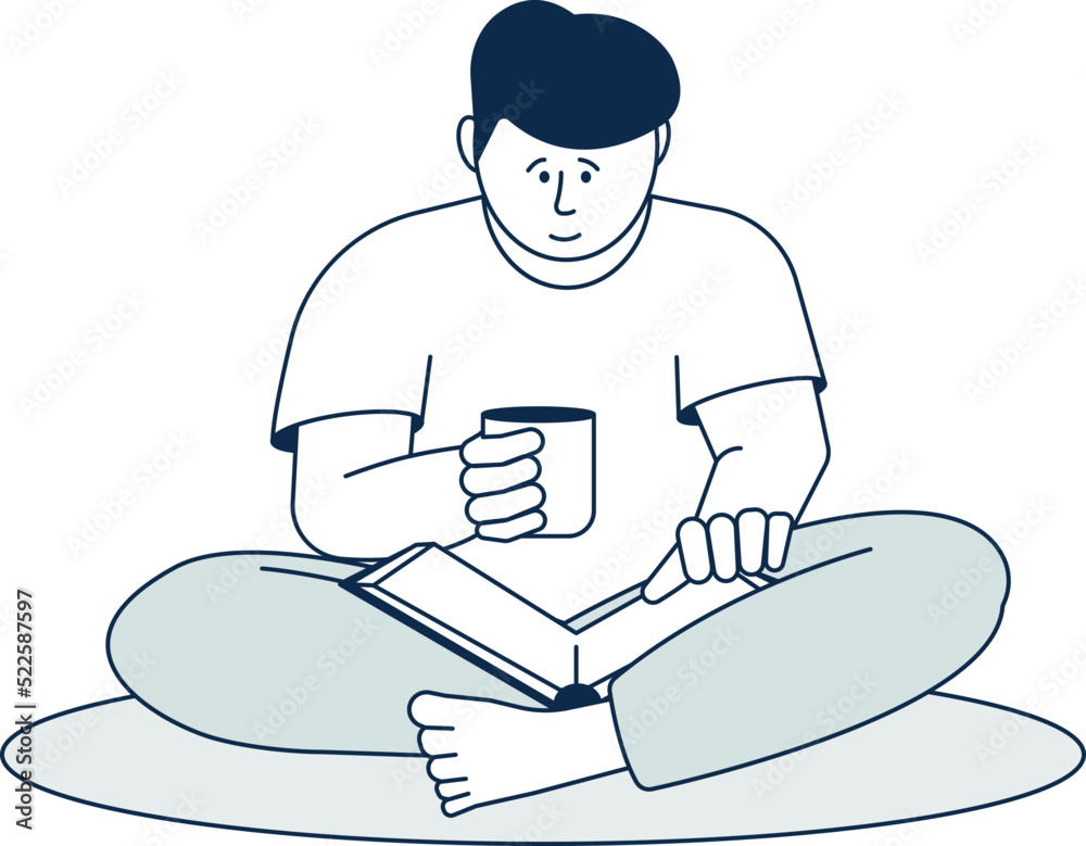 Cozy home reading. Young man with hot drink