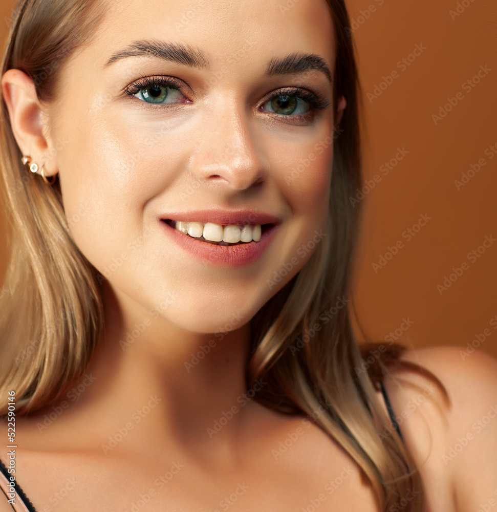 young pretty girl with blond hair posing cheerful on brown background, lifestyle people concept young pretty girl with blond hair posing cheerful on brown background, lifestyle people concept