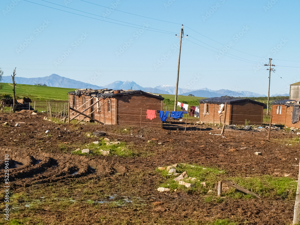Sub-standard rural workers accommodation with washing on fence